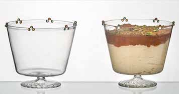 Two clear footed glass dessert cups, one empty and one filled